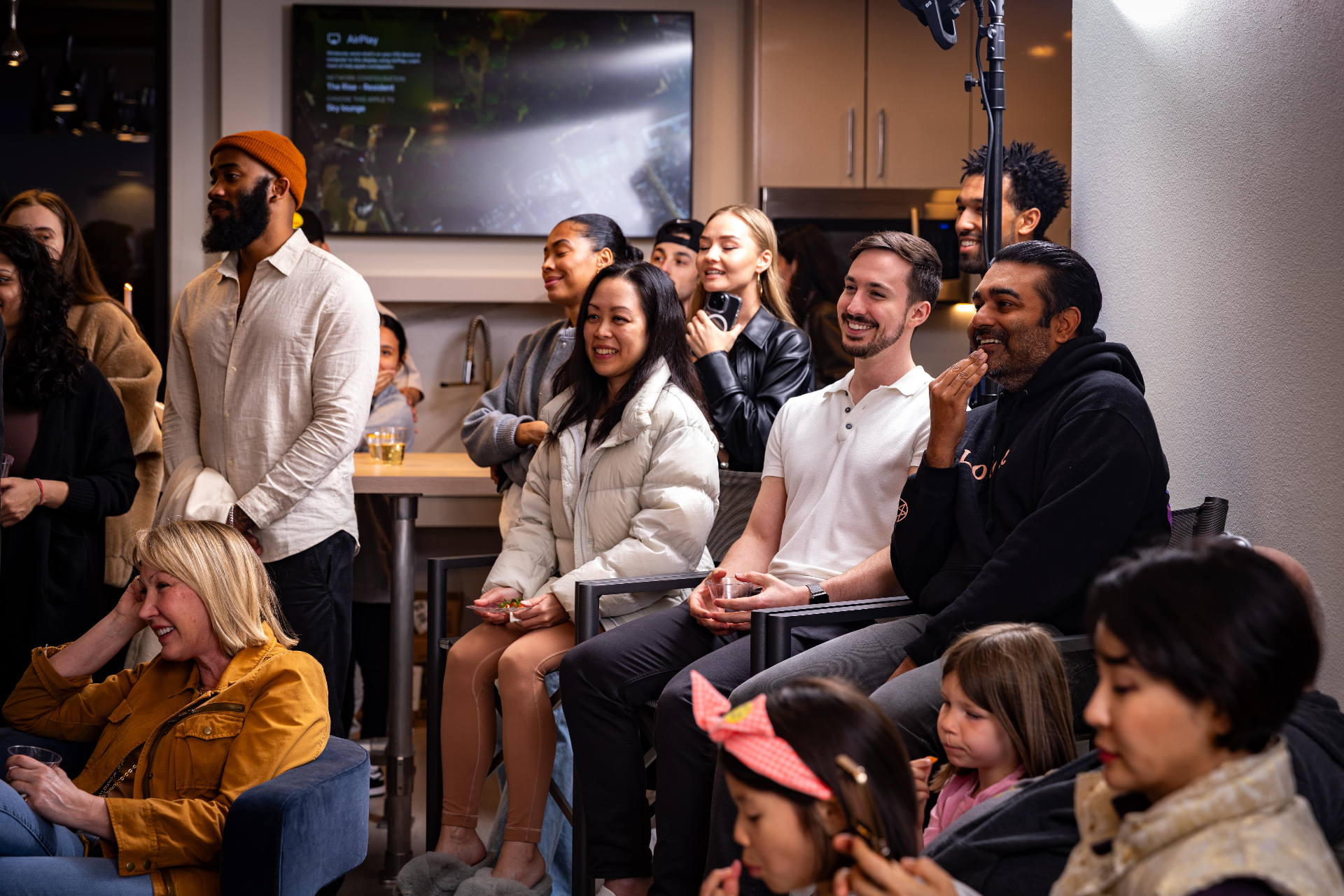 Audience reacting to Scott Syme White Rabbit magic show at a luxury event in Los Angeles