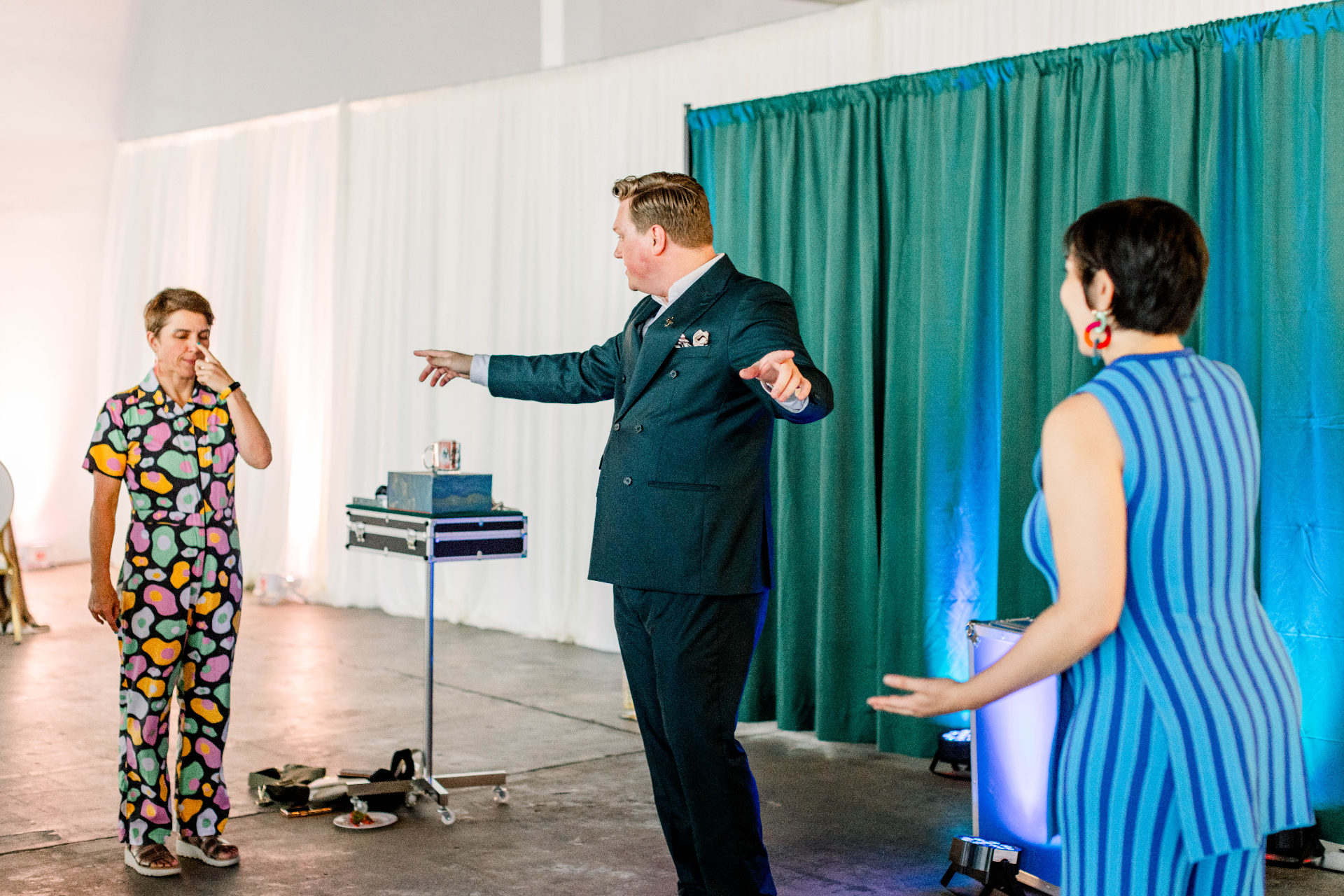 Seated audience watching a private parlor magic show
